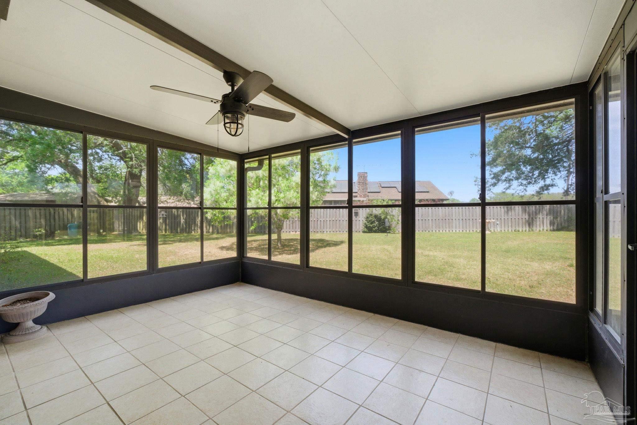 4320 Grant Street Pace, FL 32571 - Photo 6 of 27 a view of an empty room with windows