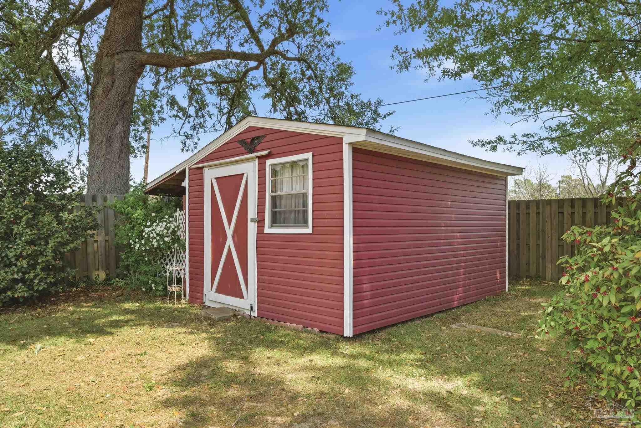 4320 Grant Street Pace, FL 32571 - Photo 8 of 27 a front view of a house with a yard