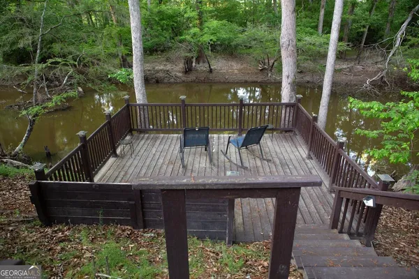 a view of a wooden deck with a bench