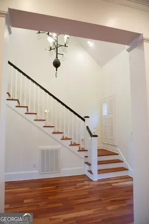 a view of a balcony with chandelier