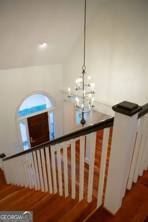 a view of a hallway with stairs