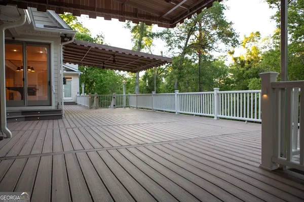 a view of outdoor space with wooden floor and yard in the back