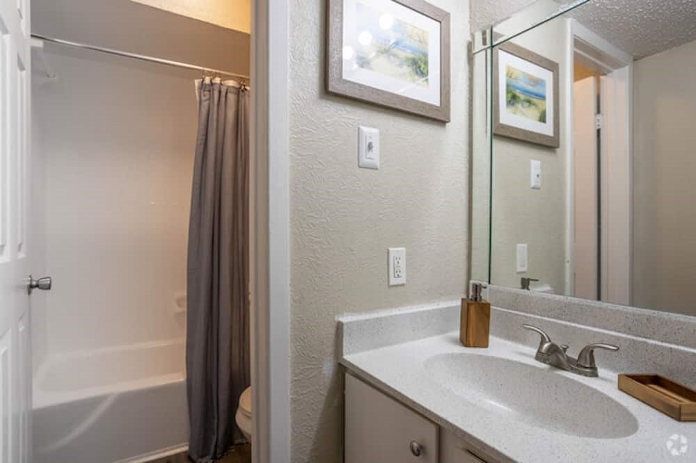 6505 Westheimer Road, Unit 118 Houston, TX 77057 - Photo 11 of 16 a bathroom with a sink and a mirror