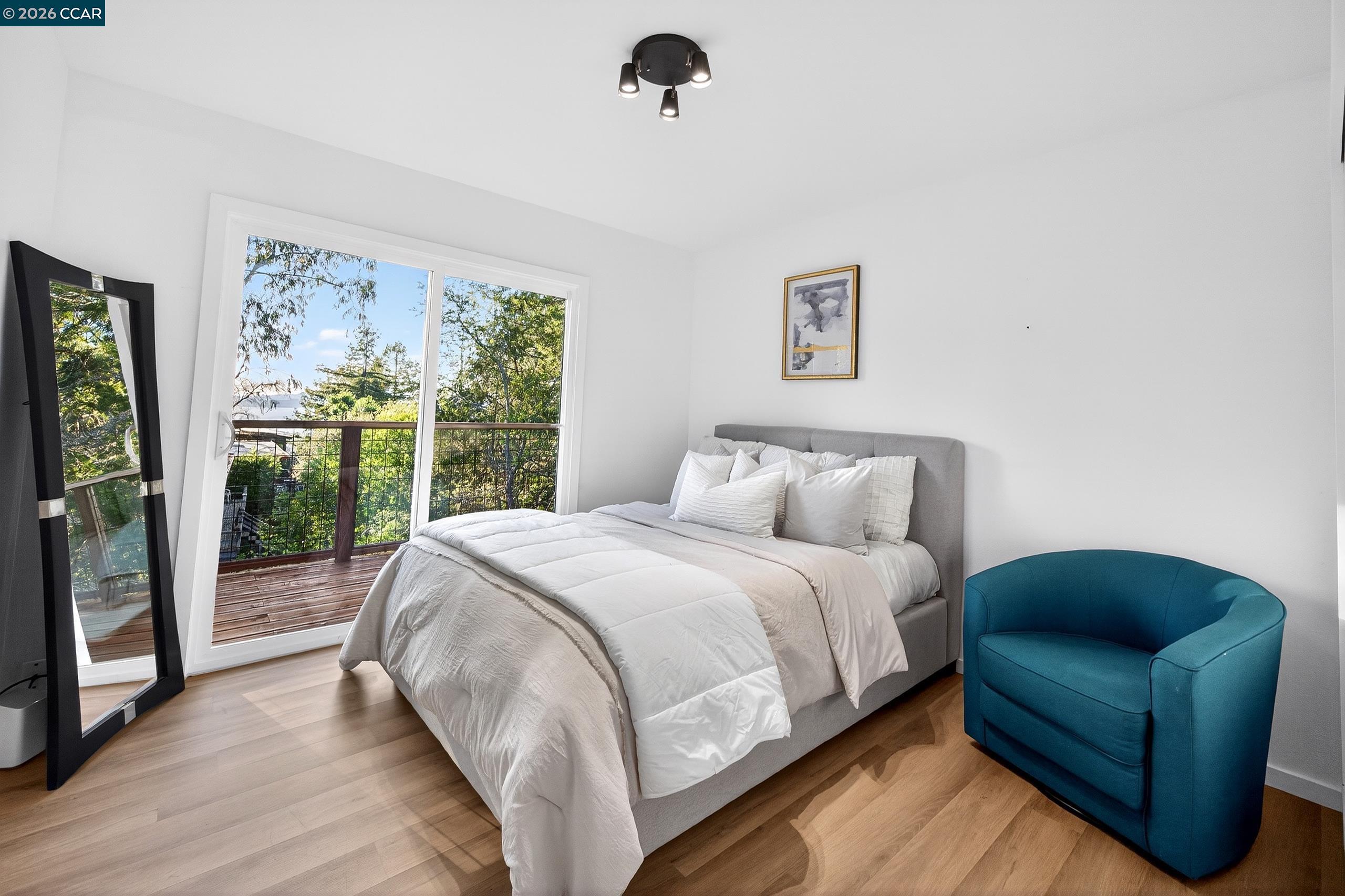 230 Fairlawn Drive Berkeley, CA 94708 - Photo 17 of 58 a bed sitting in a bedroom next to a window