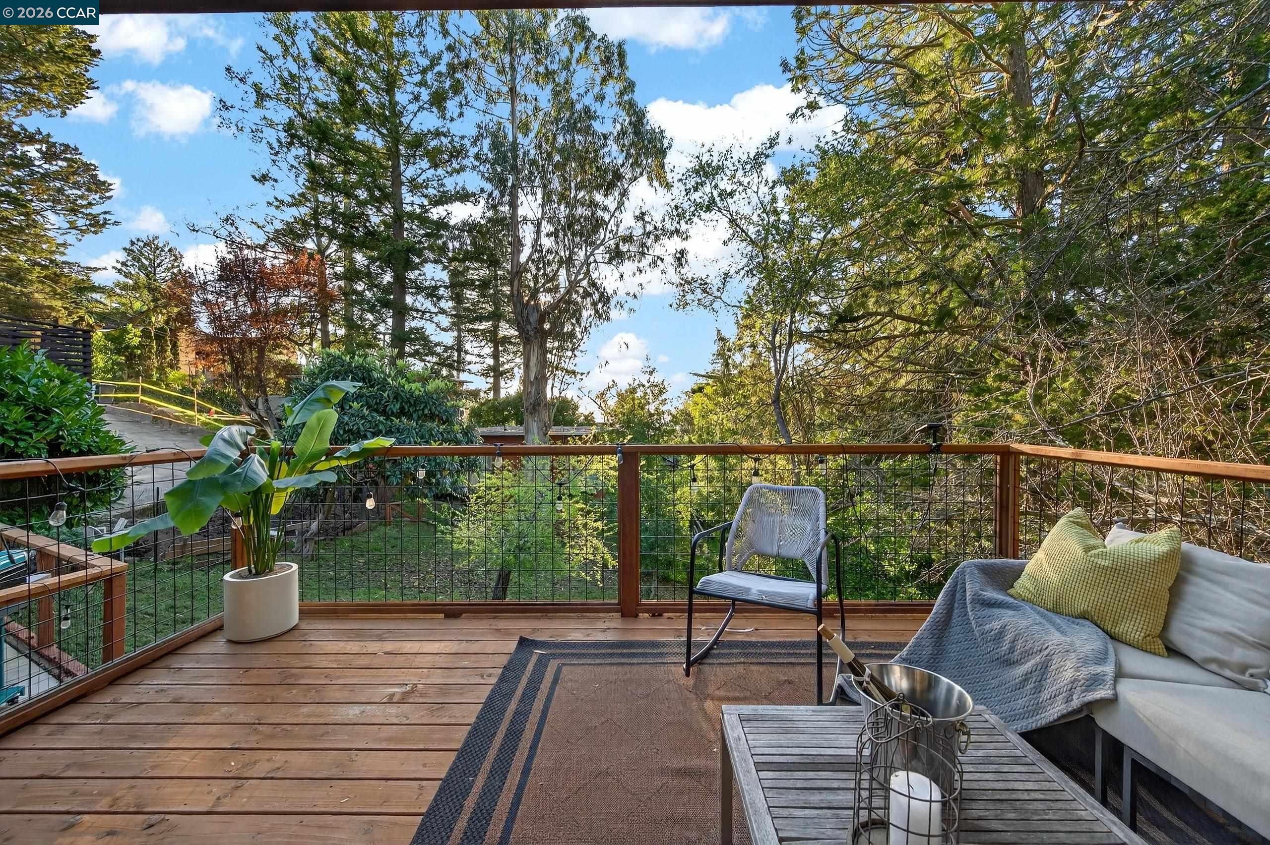 230 Fairlawn Drive Berkeley, CA 94708 - Photo 35 of 58 a balcony with wooden floor and outdoor seating