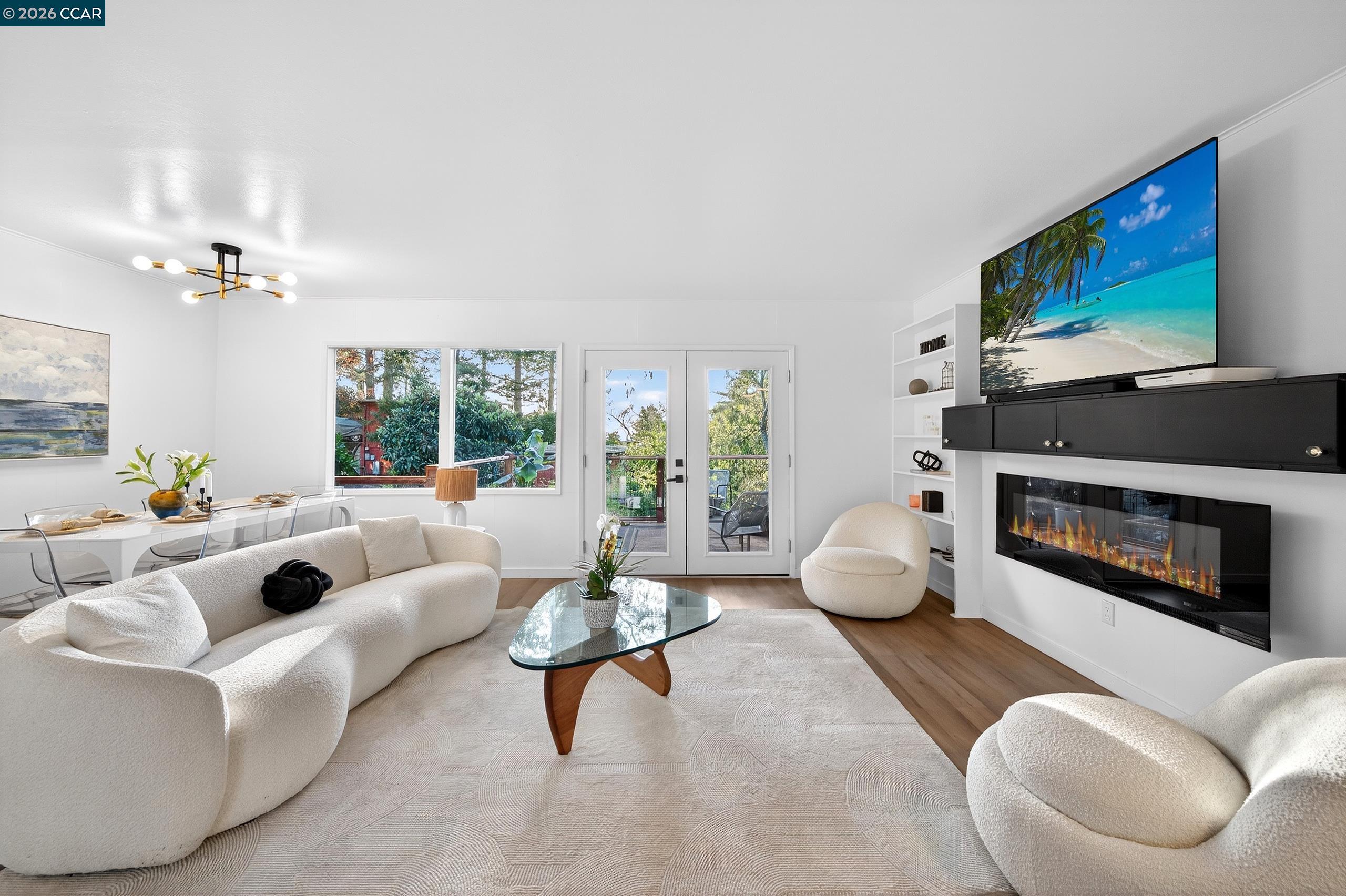 230 Fairlawn Drive Berkeley, CA 94708 - Photo 7 of 58 a living room with furniture a flat screen tv and a fireplace