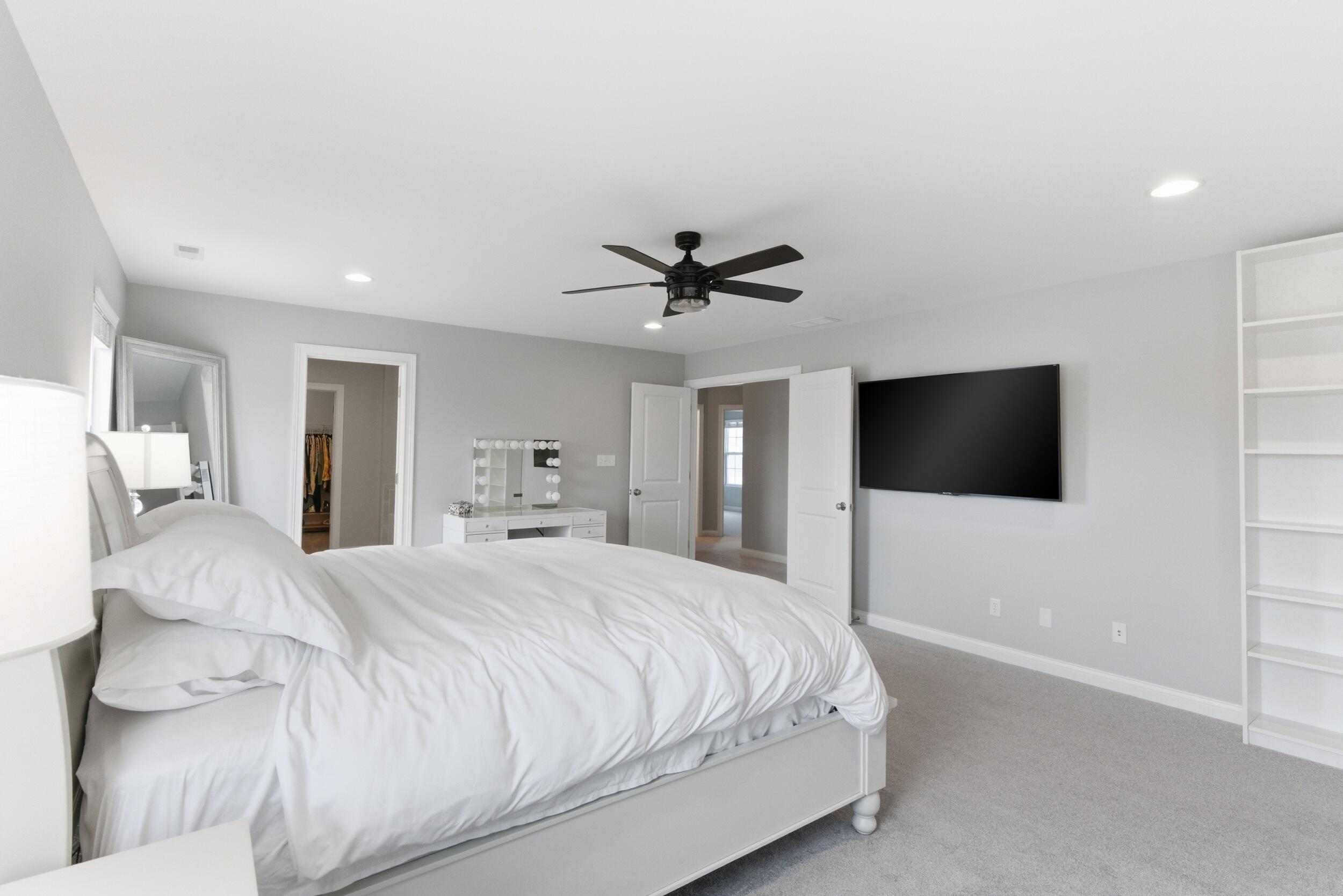 13181 Taft Street Crown Point, IN 46307 - Photo 16 of 42 a bedroom with a bed and a flat screen tv