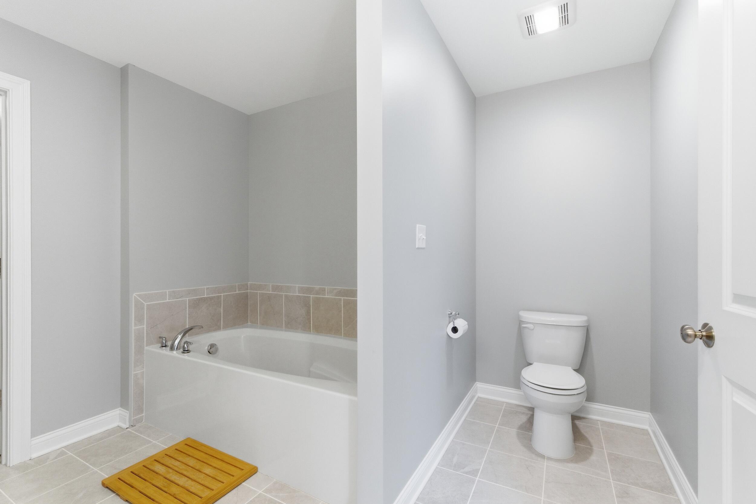 13181 Taft Street Crown Point, IN 46307 - Photo 18 of 42 a bathroom with a toilet and a shower