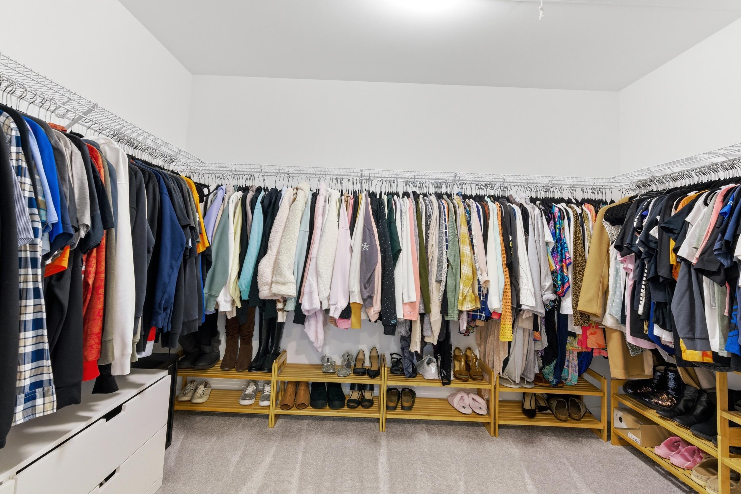 13181 Taft Street Crown Point, IN 46307 - Photo 20 of 42 a view of walk in closet with clothes