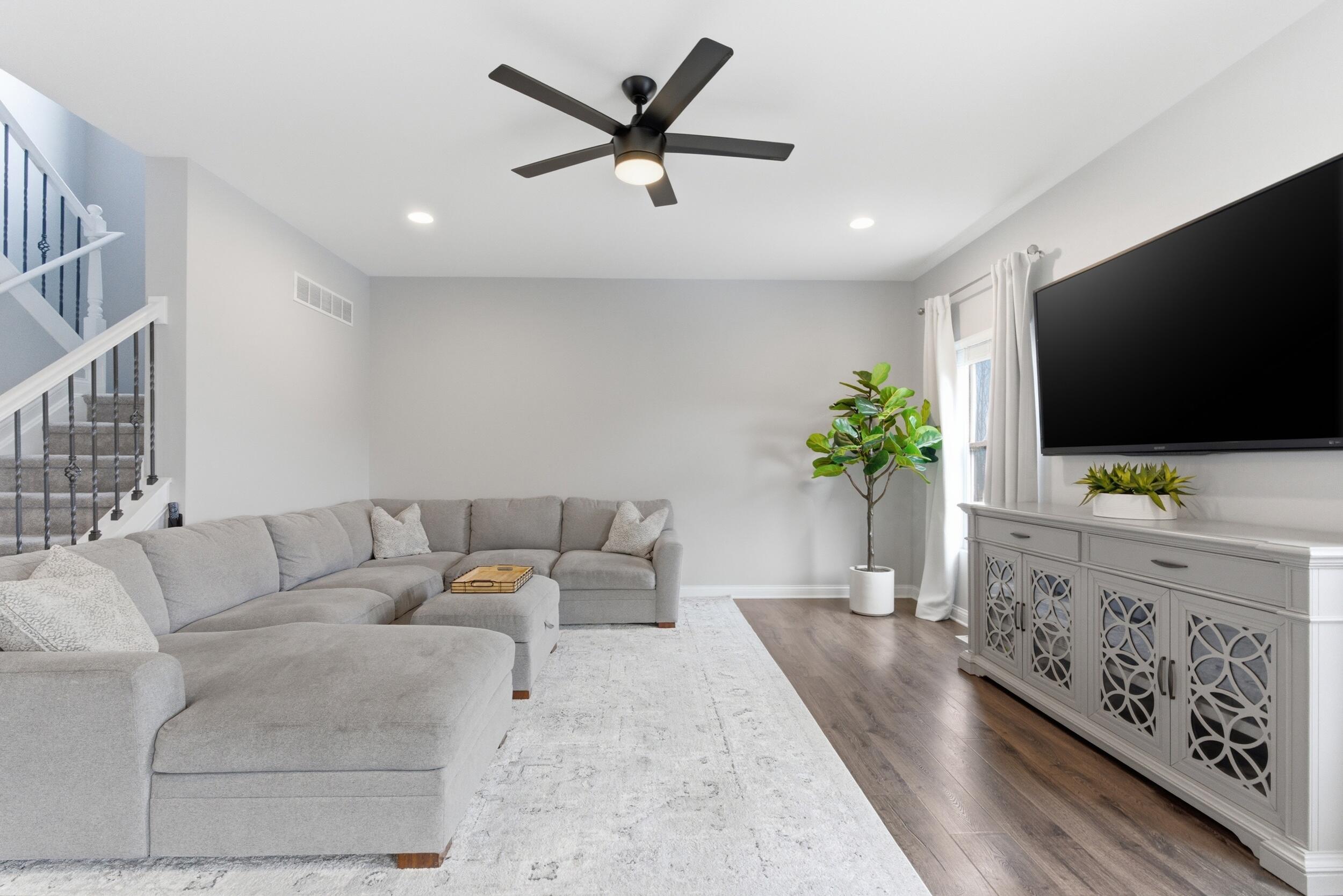 13181 Taft Street Crown Point, IN 46307 - Photo 2 of 42 a living room with furniture and a flat screen tv