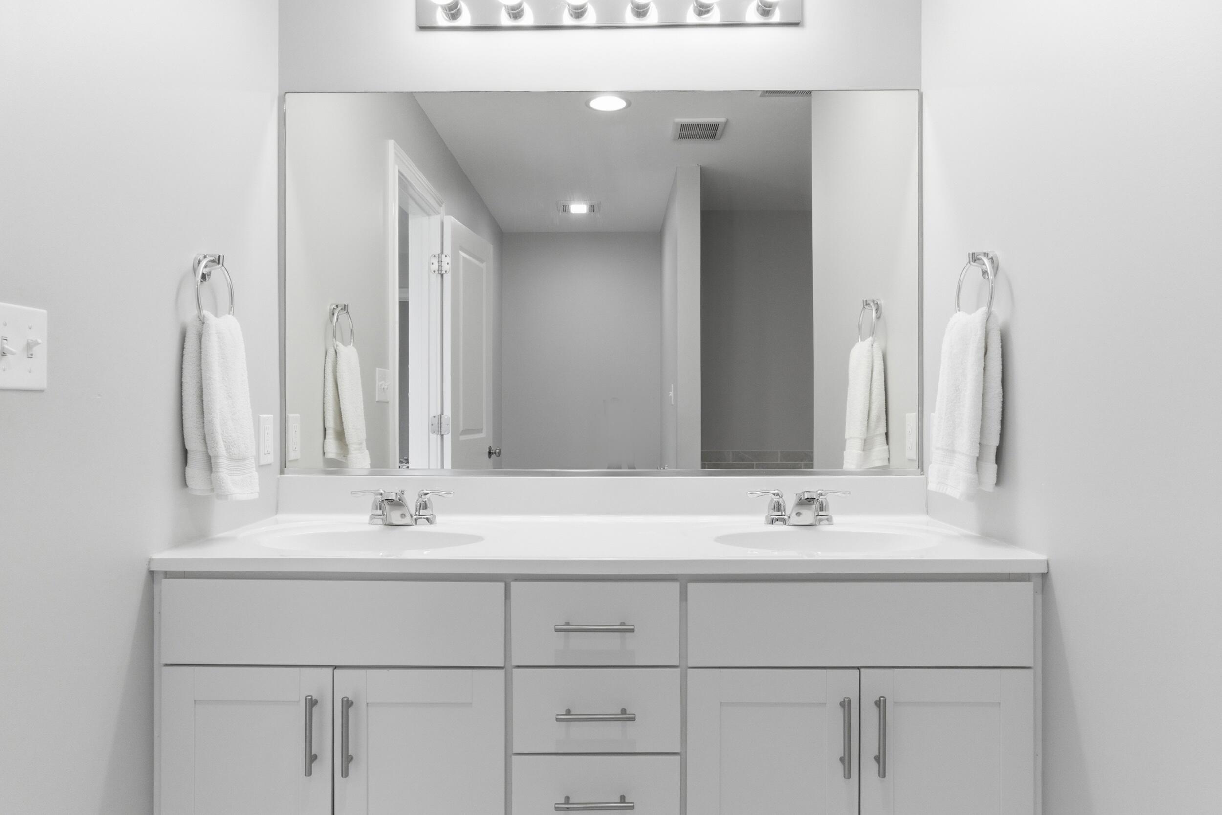 13181 Taft Street Crown Point, IN 46307 - Photo 22 of 42 a bathroom with a sink vanity and a mirror