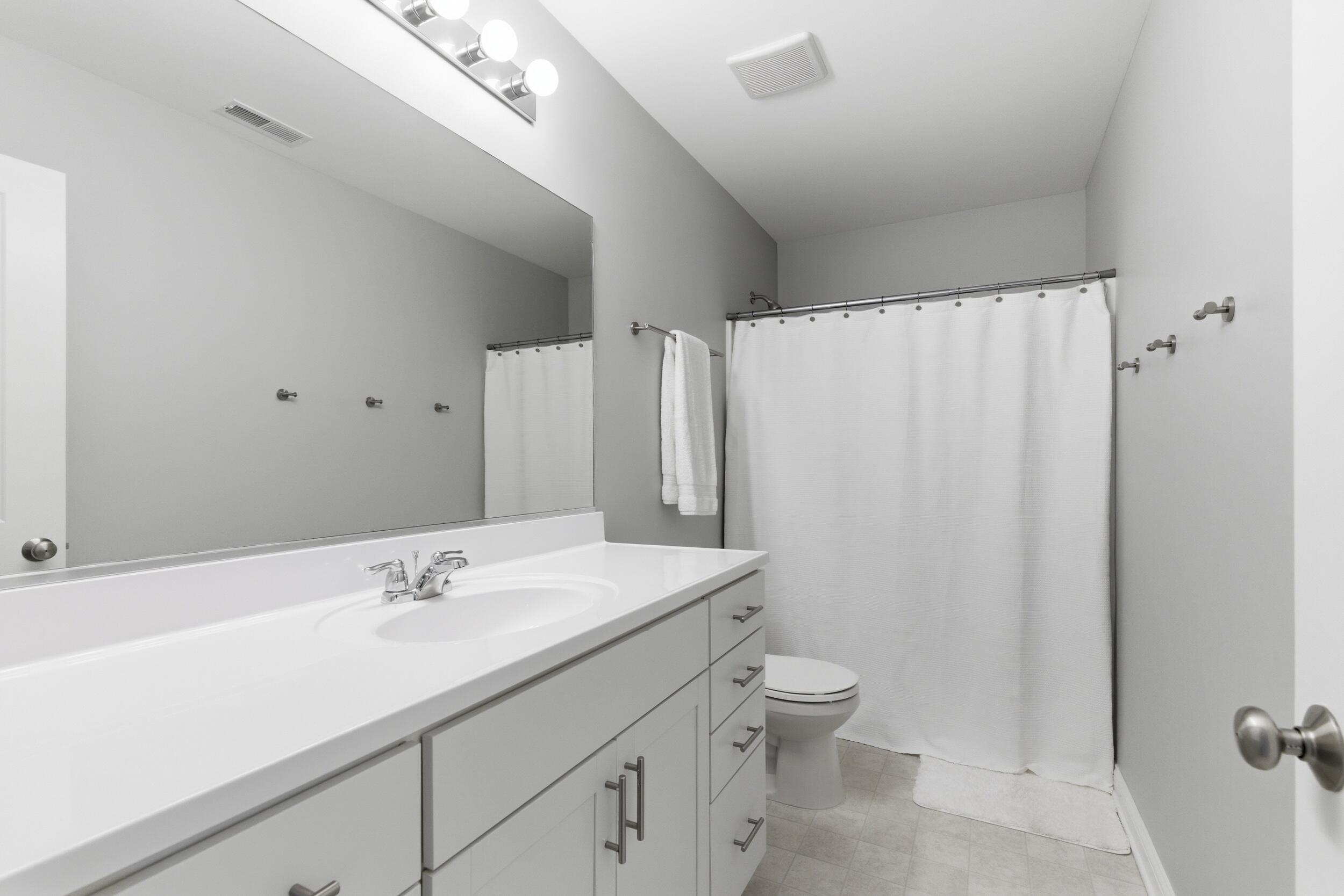 13181 Taft Street Crown Point, IN 46307 - Photo 23 of 42 a bathroom with a sink a toilet and shower