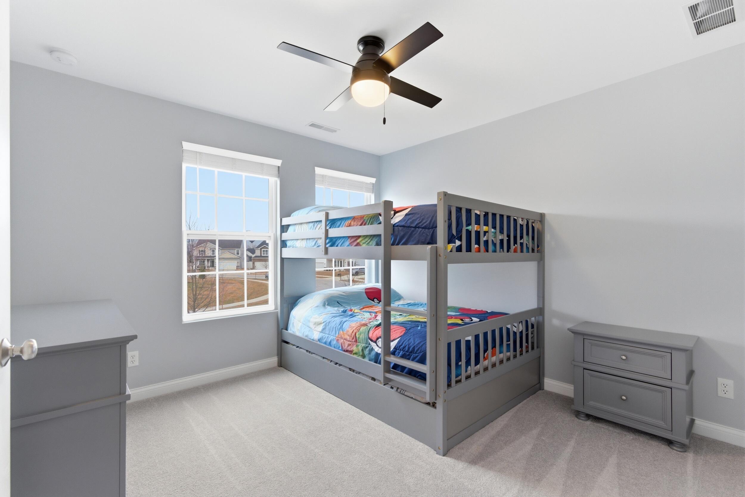 13181 Taft Street Crown Point, IN 46307 - Photo 25 of 42 a bedroom with a bed and a baby crib