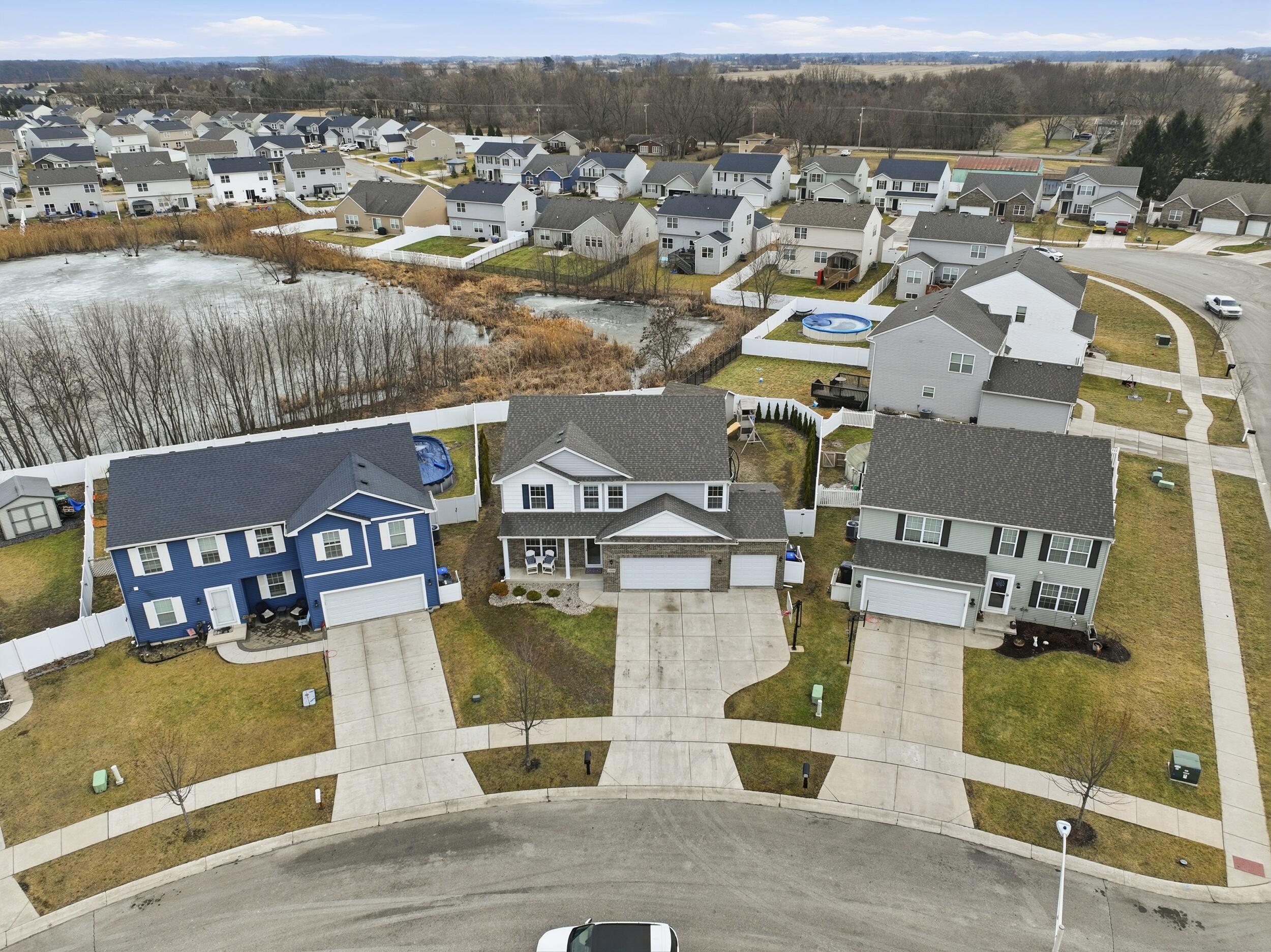 13181 Taft Street Crown Point, IN 46307 - Photo 37 of 42 an aerial view of residential houses with outdoor space and parking