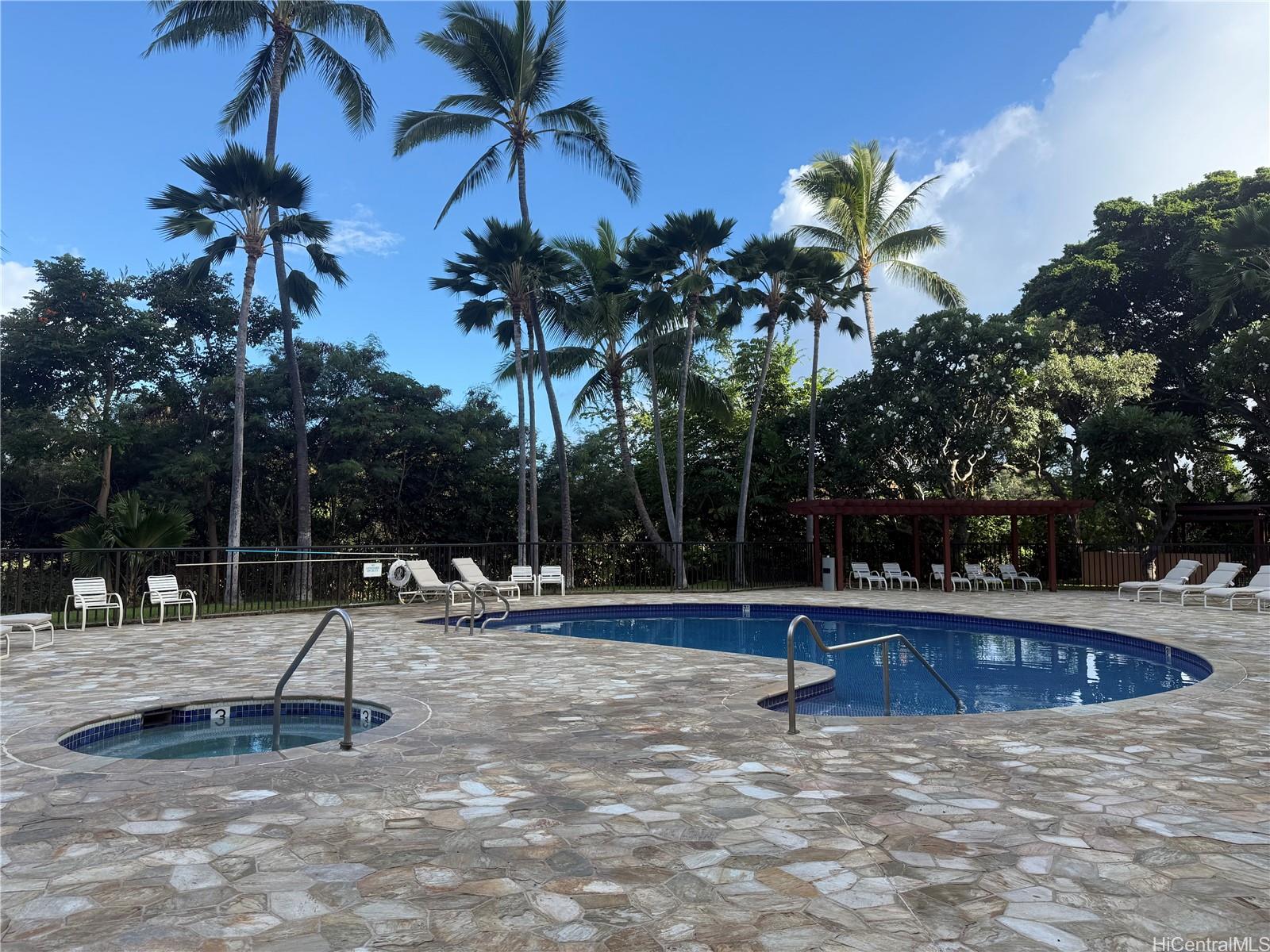 5333 Likini Street, Unit 1008 Honolulu, HI 96818 - Photo 13 of 17 a view of a park with swings and slides