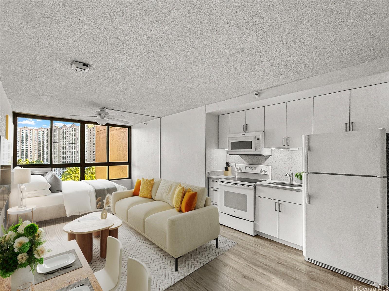 5333 Likini Street, Unit 1008 Honolulu, HI 96818 - Photo 6 of 17 a kitchen with stainless steel appliances a refrigerator a stove a sink and white cabinets