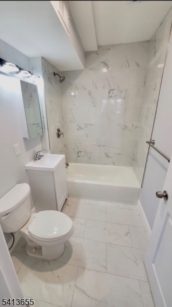 80 South Devine Street Newark, NJ 07106 - Photo 2 of 4 a white toilet sitting next to a bath tub