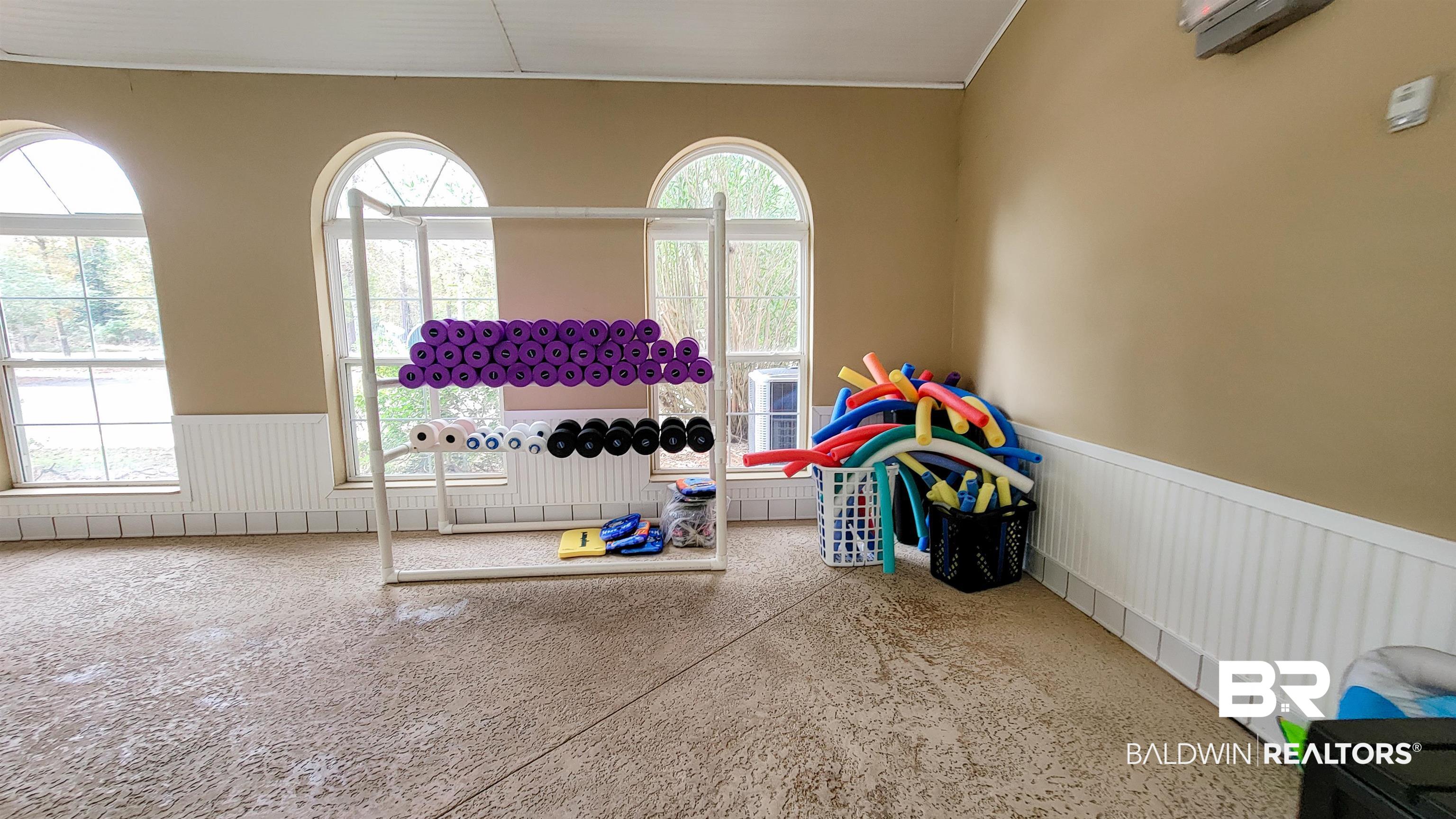 214 Hemingway Loop Foley, AL 36535 - Photo 45 of 67 Rec room featuring a wainscoted wall