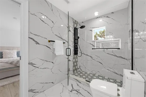 a view of entryway and hall with a bath tub