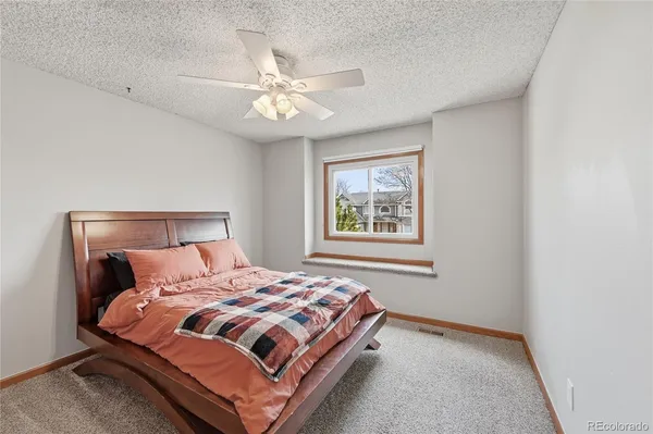 a view of a room that has a large window and front view