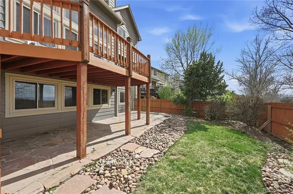 a view of a house with a yard and stairs