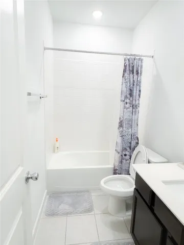 a bathroom with a sink a toilet and a bathtub
