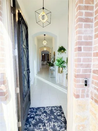 a view of a hallway to a window