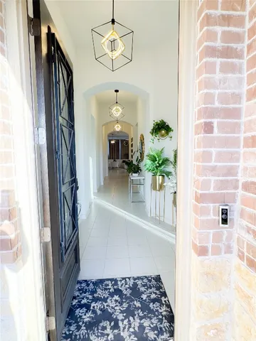 a view of a hallway to a window