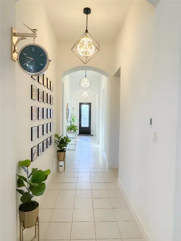 a view of a hallway with seating area