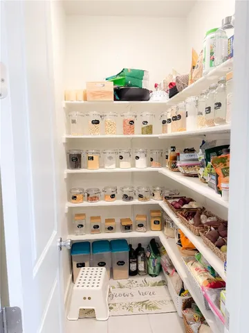 a shelf with books and knick knacks on it