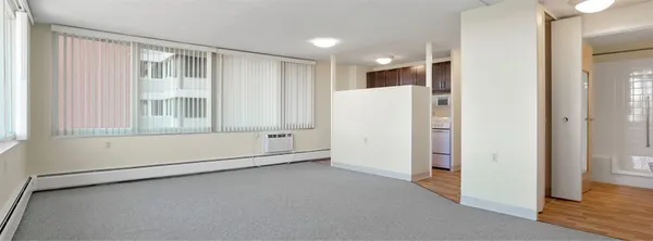 a view of an empty room with a window
