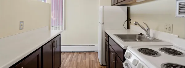 a utility room with sink dryer and washer