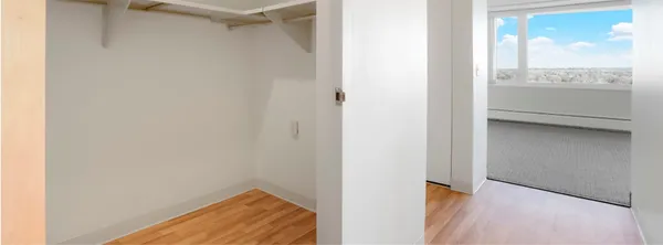 a view of walk in closet with an empty space