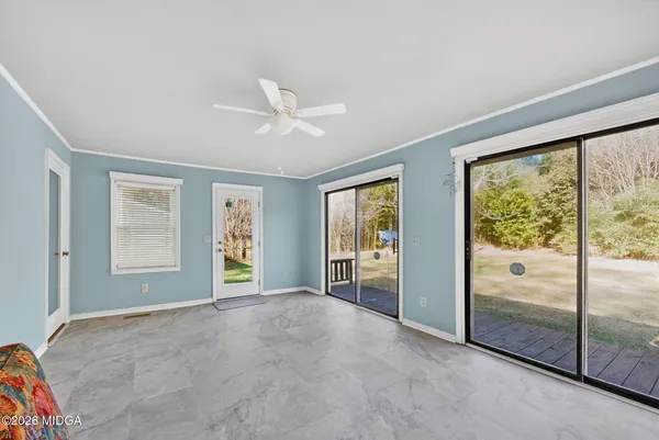 a view of an empty room with a window