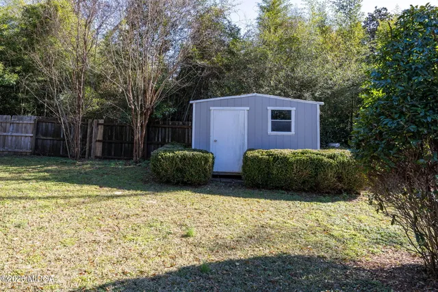 a view of a backyard of the house