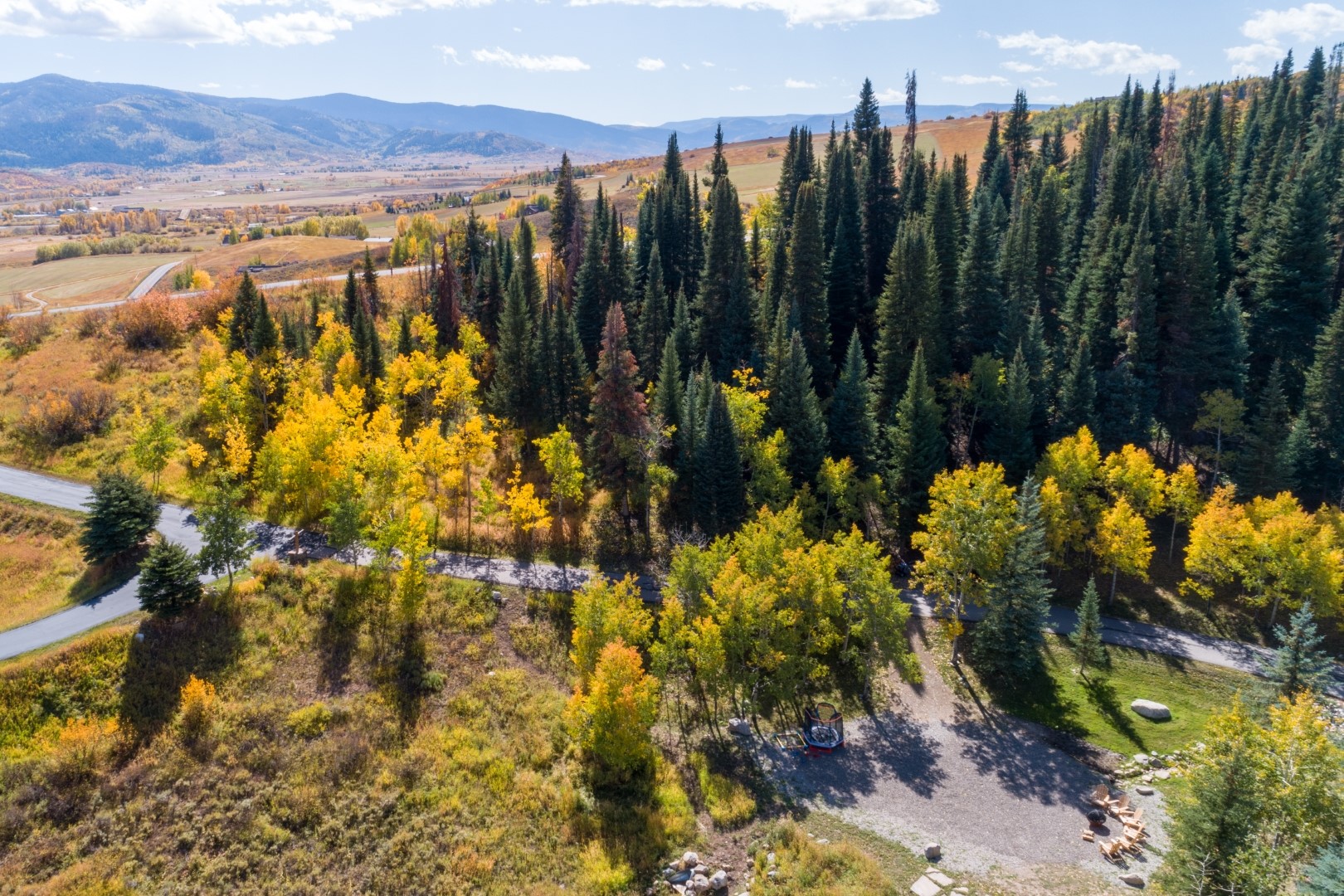31655 Sugar Ridge Road Steamboat Springs, CO 80487 - Photo 23 of 49 a view of a lake with a house in the background