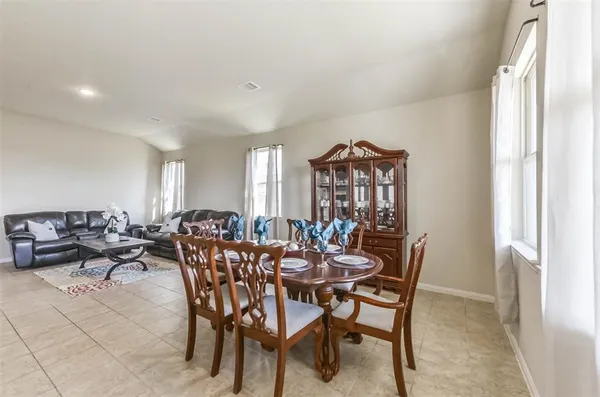 a kitchen that has a sink and a stove in it