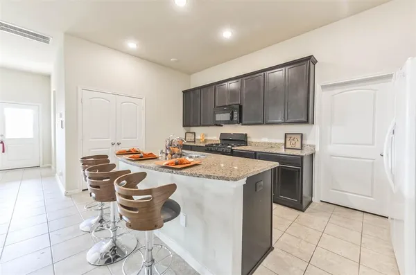 a view of kitchen with cabinets and stainless steel appliances