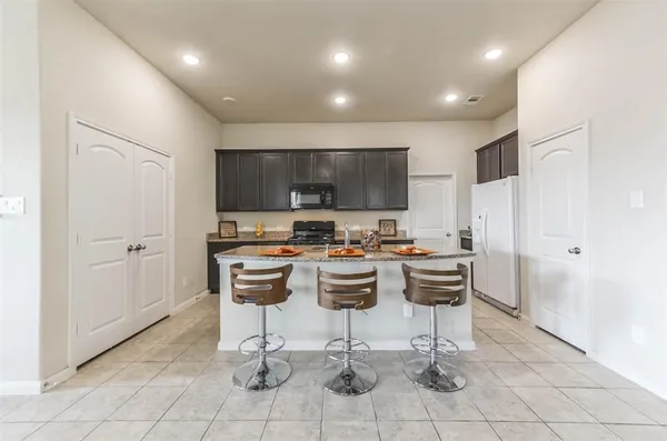 a view of a hallway with a wooden floor
