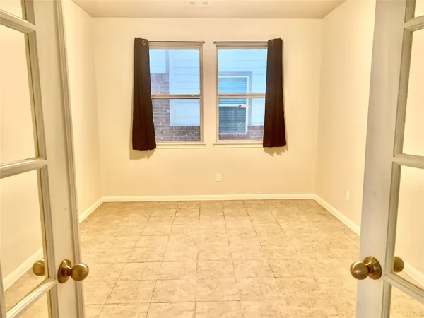 a white bath tub sitting next to a toilet