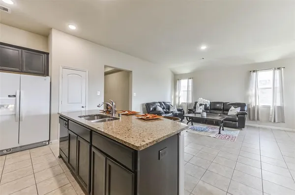 a living room with furniture and a table