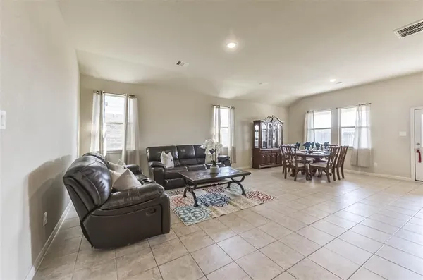 a view of a dining room with furniture window and outside view
