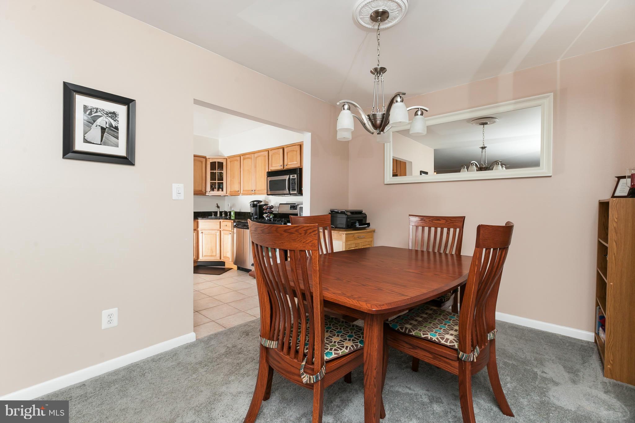 16 Cross Keys Road, Unit 16D Baltimore, MD 21210 - Photo 8 of 29 a view of a dining room with furniture
