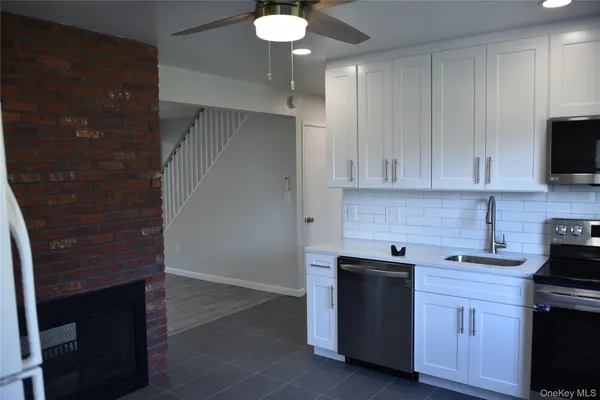 a kitchen with a sink and cabinets