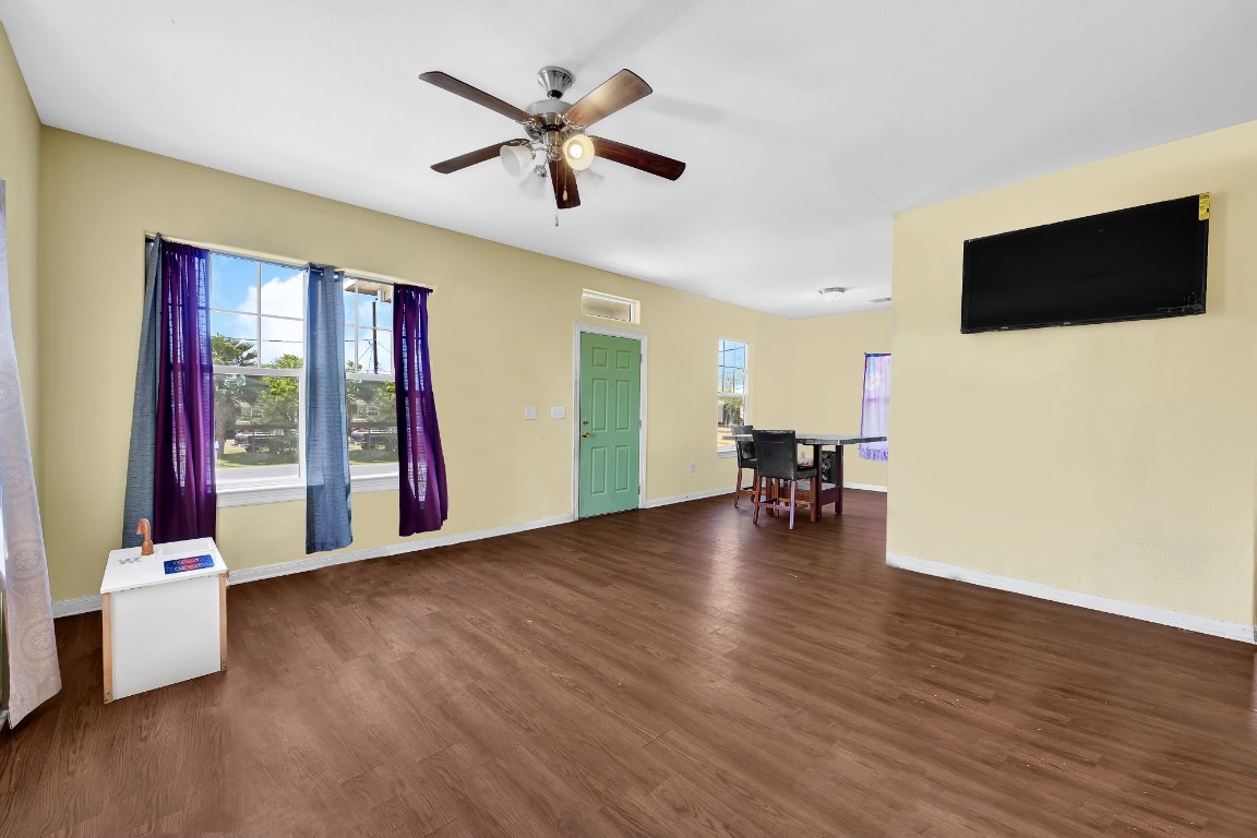 771 10th Street Dickinson, TX 77539 - Photo 11 of 24 a living room with furniture and a flat screen tv