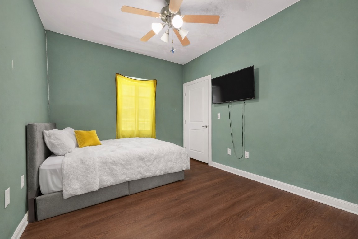 771 10th Street Dickinson, TX 77539 - Photo 12 of 24 a bedroom with a bed and a flat screen tv