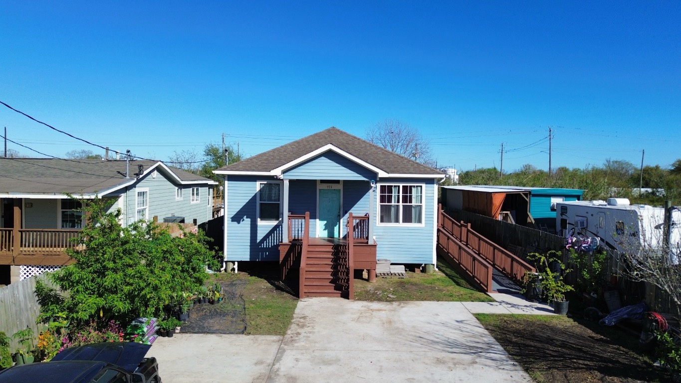 771 10th Street Dickinson, TX 77539 - Photo 21 of 24 a front view of a house with a yard