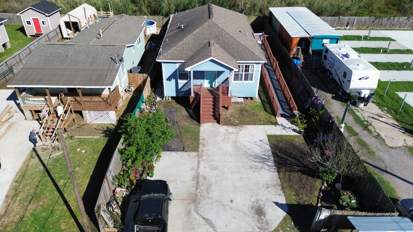 771 10th Street Dickinson, TX 77539 - Photo 22 of 24 an aerial view of a house with a yard