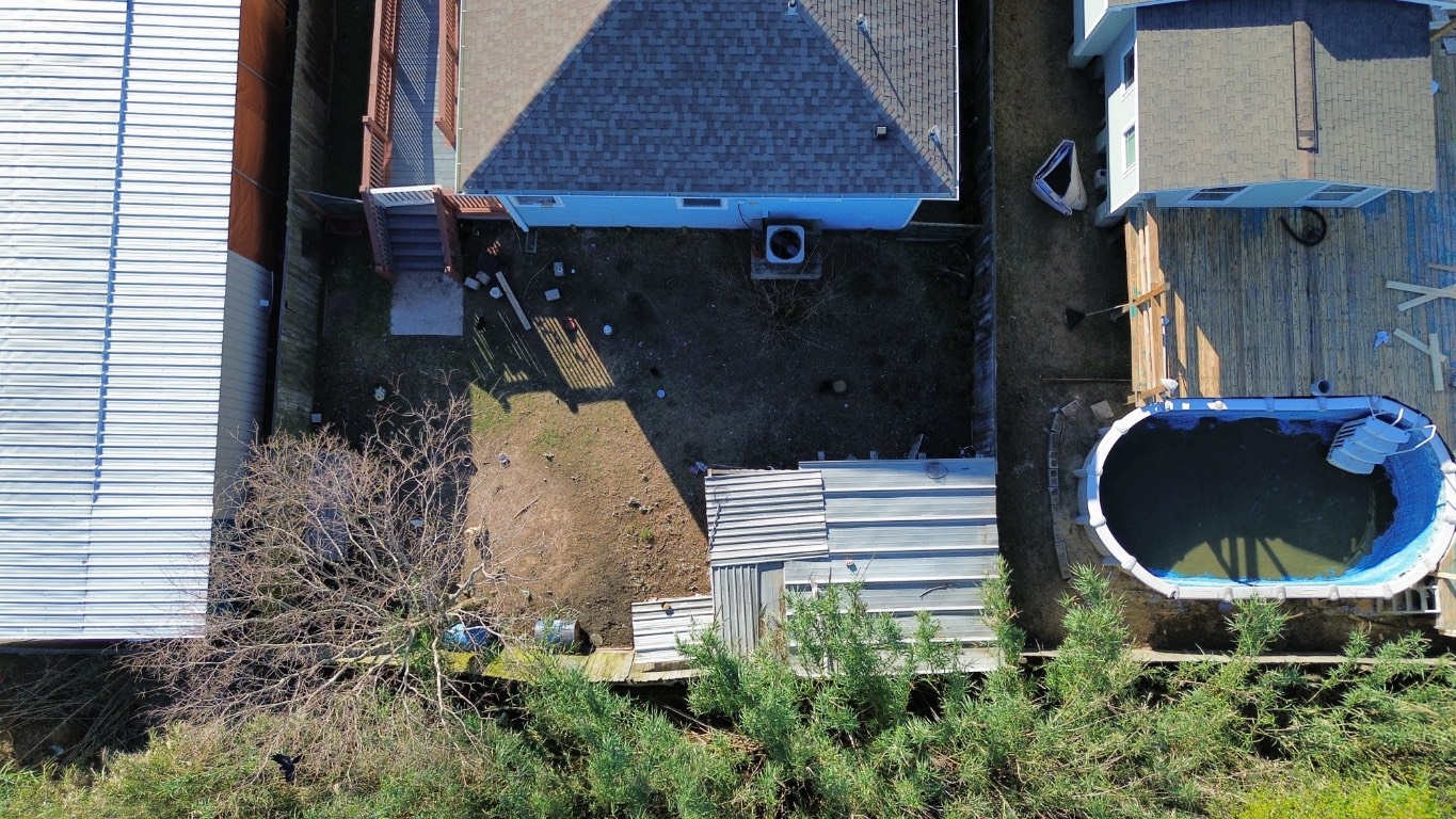771 10th Street Dickinson, TX 77539 - Photo 24 of 24 an aerial view of a house roof deck and garden