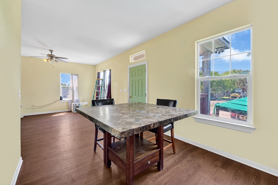 771 10th Street Dickinson, TX 77539 - Photo 8 of 24 a dining room with wooden floor and a window